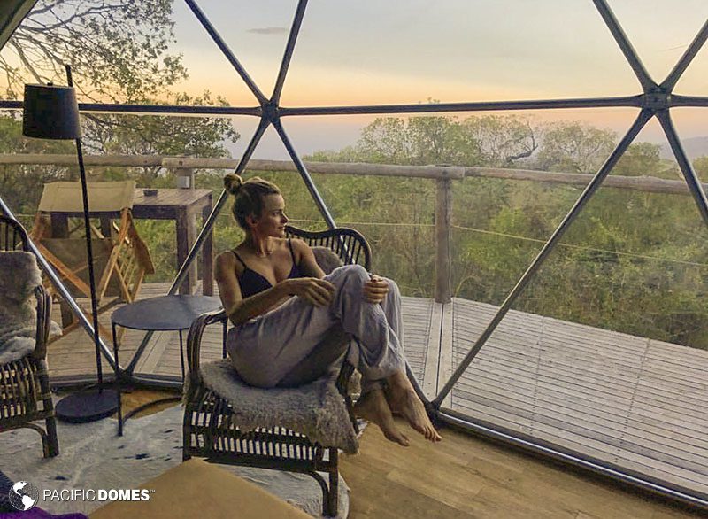 woman on chair inside dome home